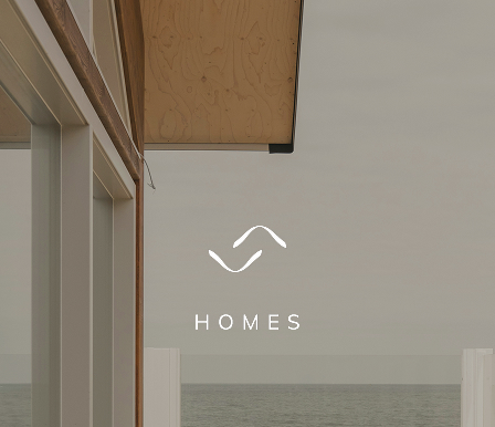 Triada Homes Logo on a modern clean house and sky background